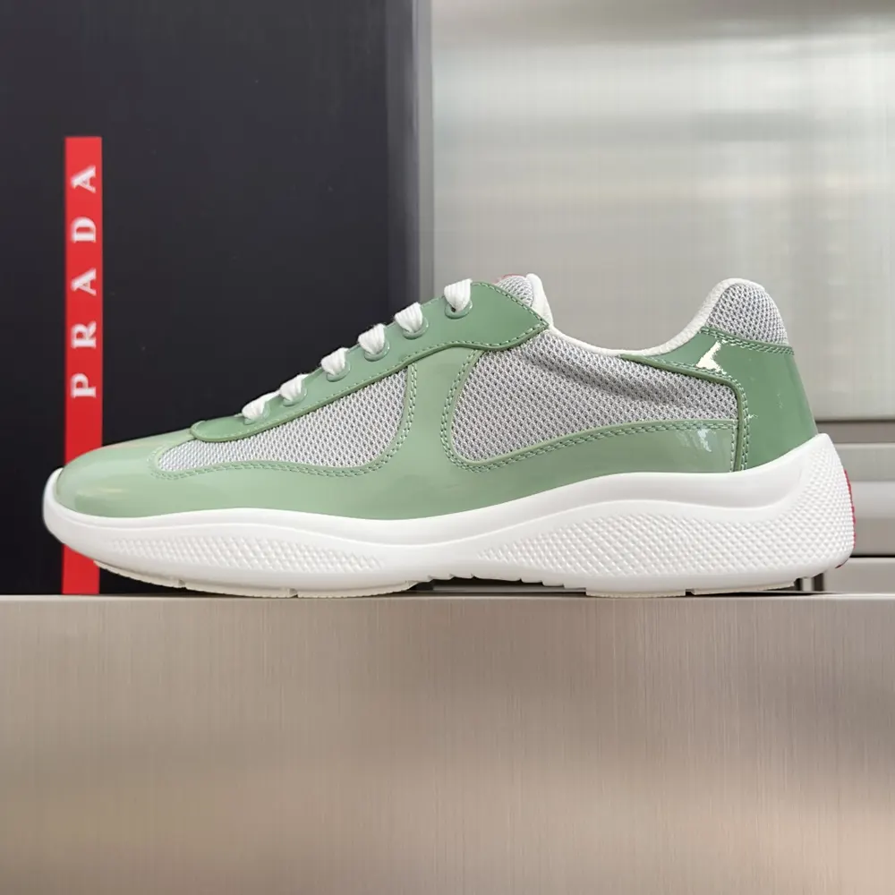 Close-up on aqua patent leather and technical fabric details of Prada America’S Cup Sneakers