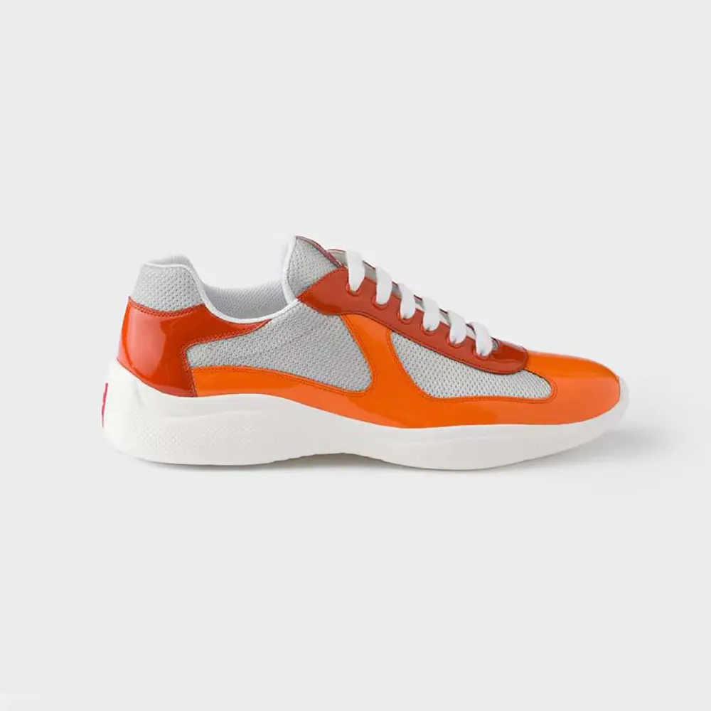 Side angle of Prada Unisex Patent Leather And Technical Fabric Prada America’S Cup Sneakers-Orange
