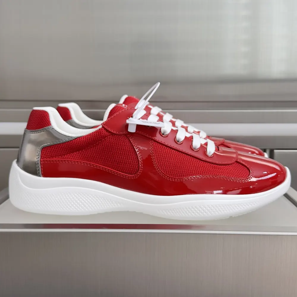 Close-up of red patent leather and fabric on Prada America’s Cup sneakers