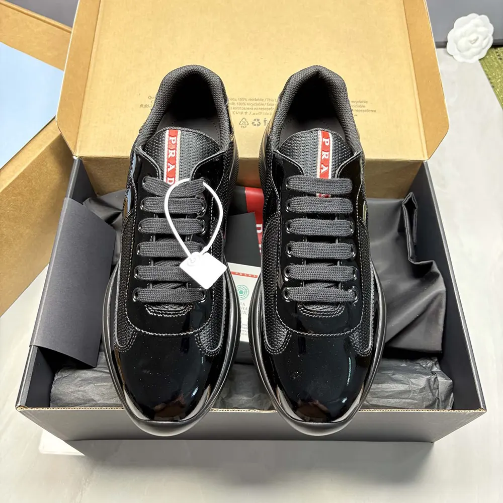 Close-up on black patent leather and technical fabric detail of Prada America’s Cup Sneakers