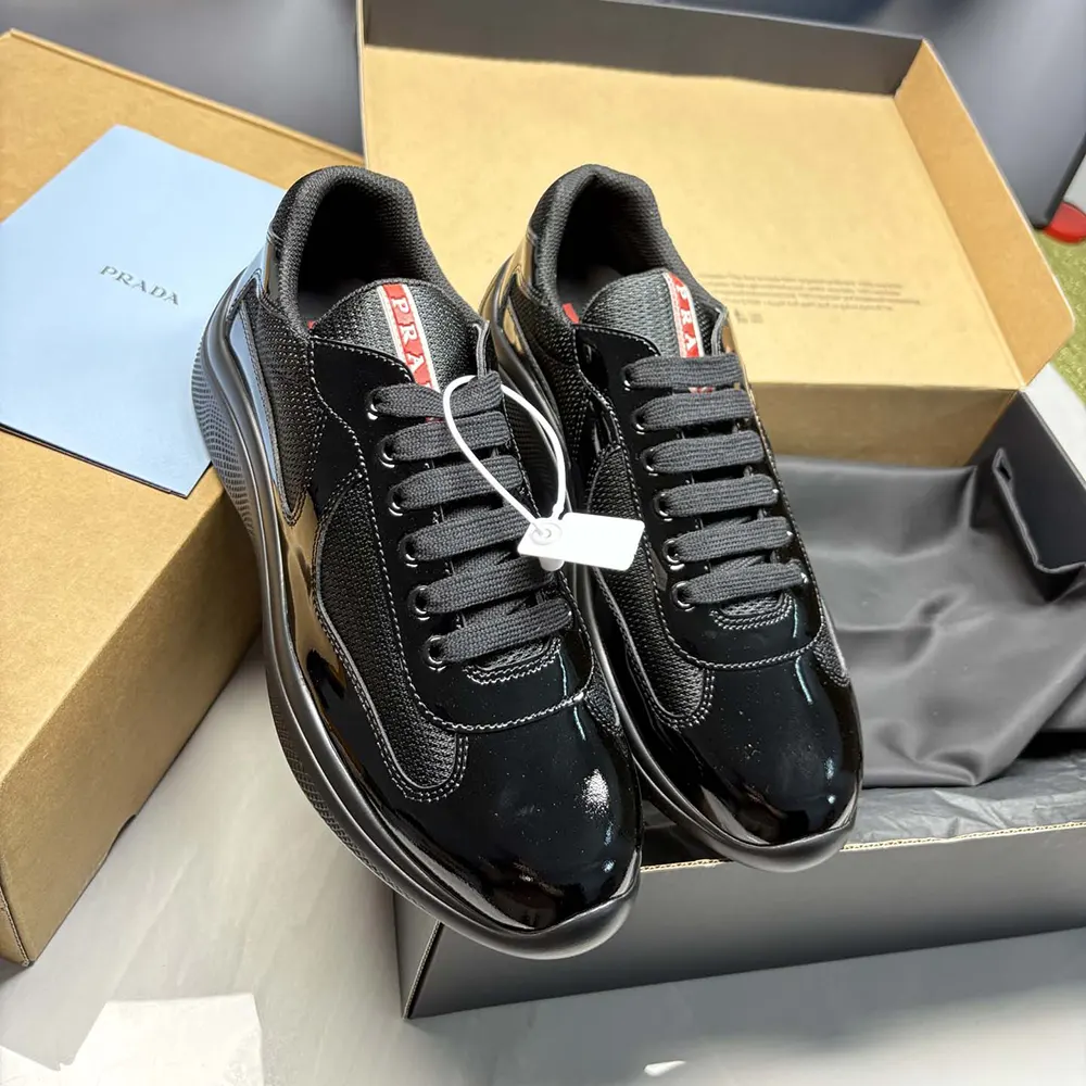 Top-down view showing lace-up closure on Prada America’s Cup Sneakers in black