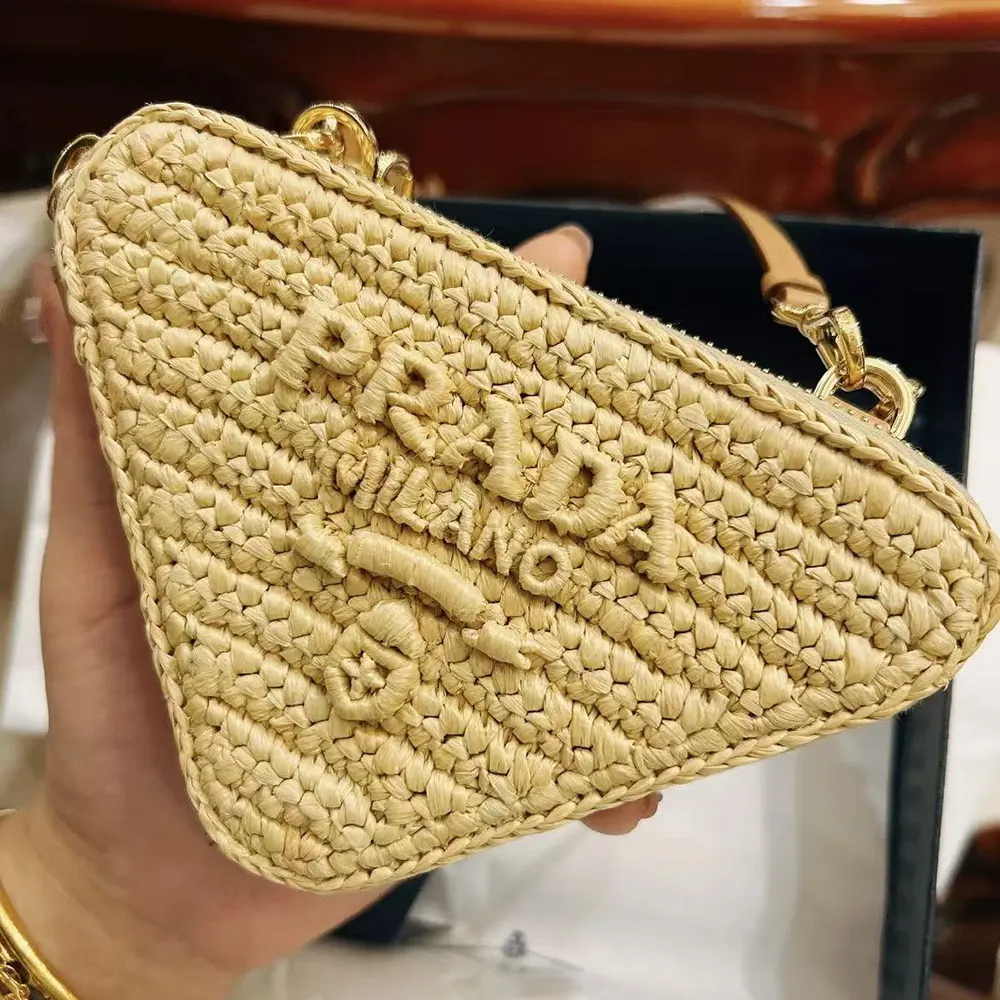 Side angle showing silver hardware on Prada Women Crochet Eather Mini Pouch Bag-Natural