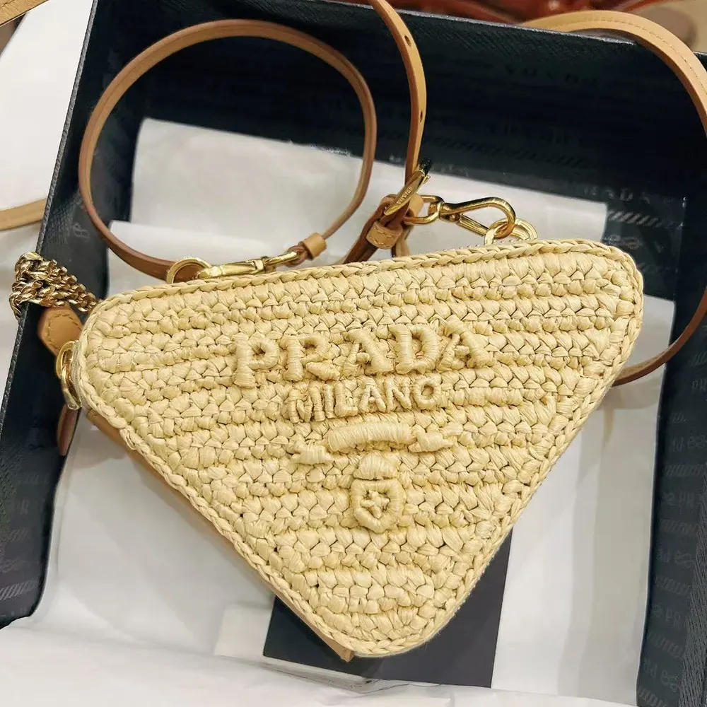 Close-up of textured crochet and leather trim on Prada mini pouch