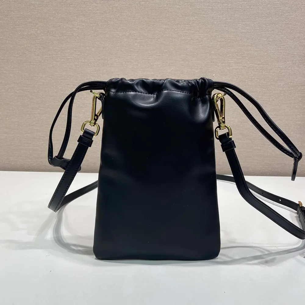 Side angle showing slim silhouette of Prada Women Nappa Leather Pouch
