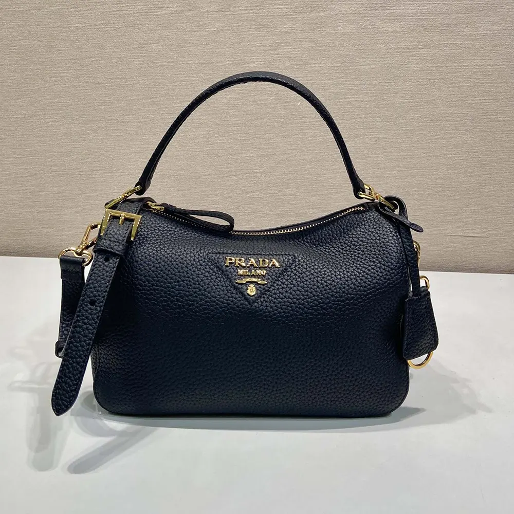 Close-up of smooth calf leather texture and Prada emblem detail