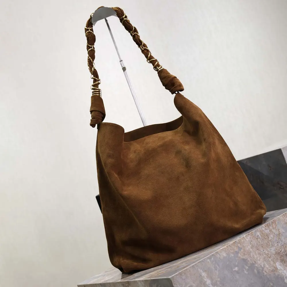 Side angle showing soft suede texture of Saint Laurent YSL Amalia bag