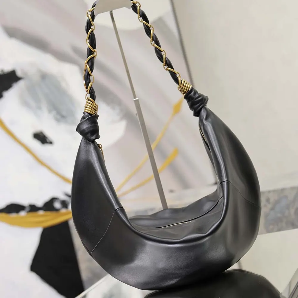 Side angle showing the compact silhouette of Saint Laurent YSL Amalia Small Hobo