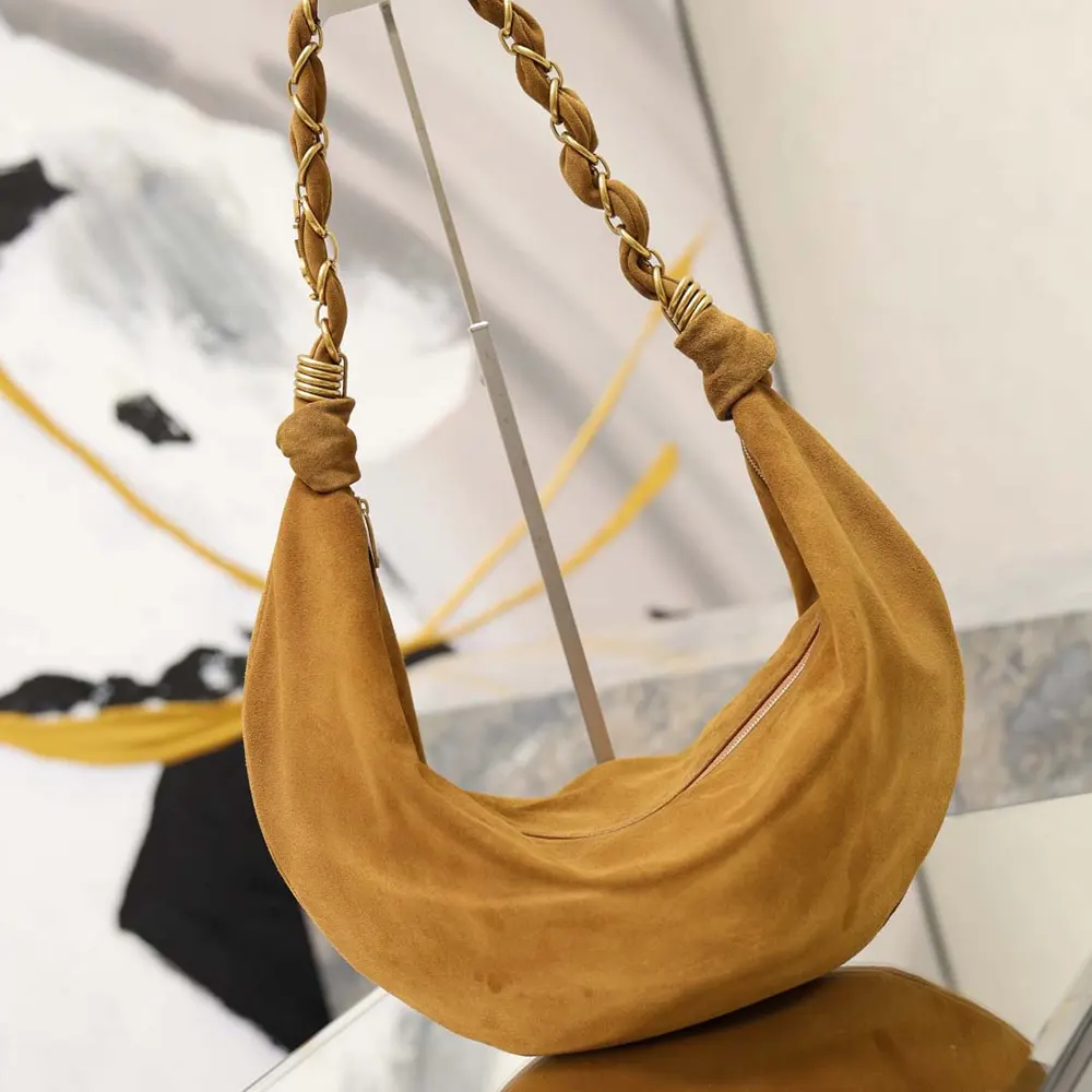 Side angle showing slim silhouette of Saint Laurent YSL Amalia Small Hobo