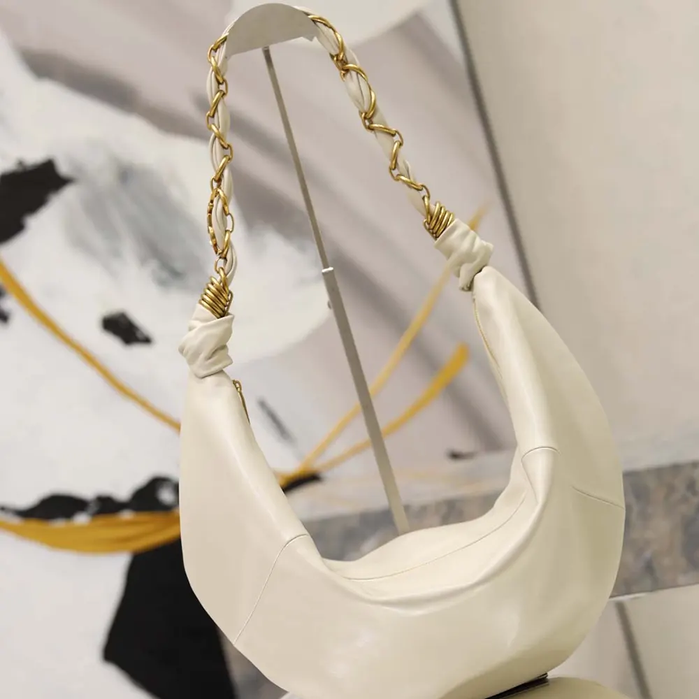 Side angle showing silhouette of Saint Laurent YSL Women Amalia Small Hobo