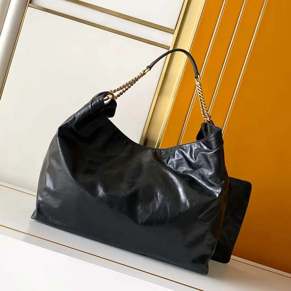 Side profile showing soft hobo silhouette of Saint Laurent YSL Hortense bag