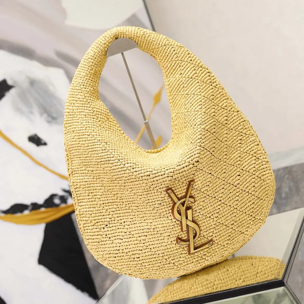 Side profile showing natural raffia texture of Icare Hobo bag