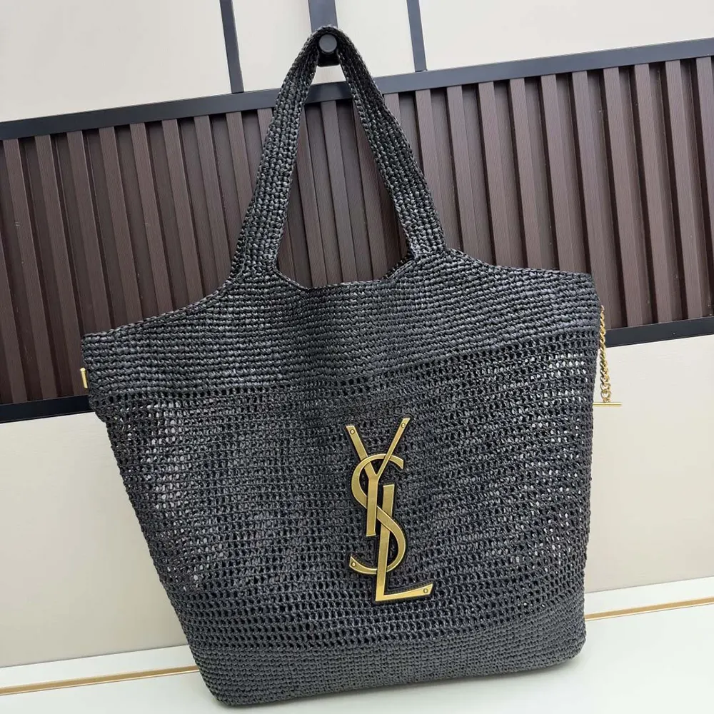 Close-up of gold YSL hardware on Icare In Raffia Black