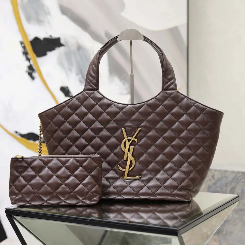 Close-up of gold YSL logo hardware on Icare Medium Quilted Nappa Burgundy