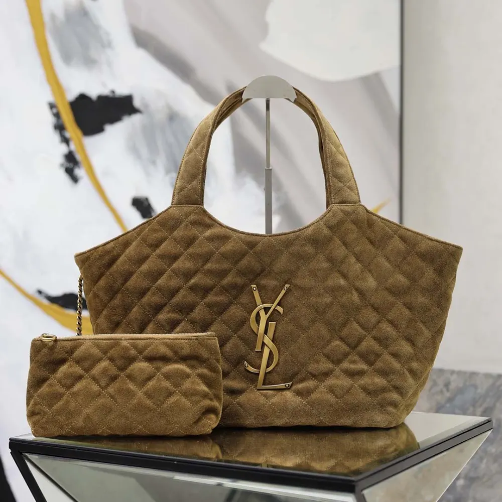 Close-up on gold YSL logo and quilted suede detail