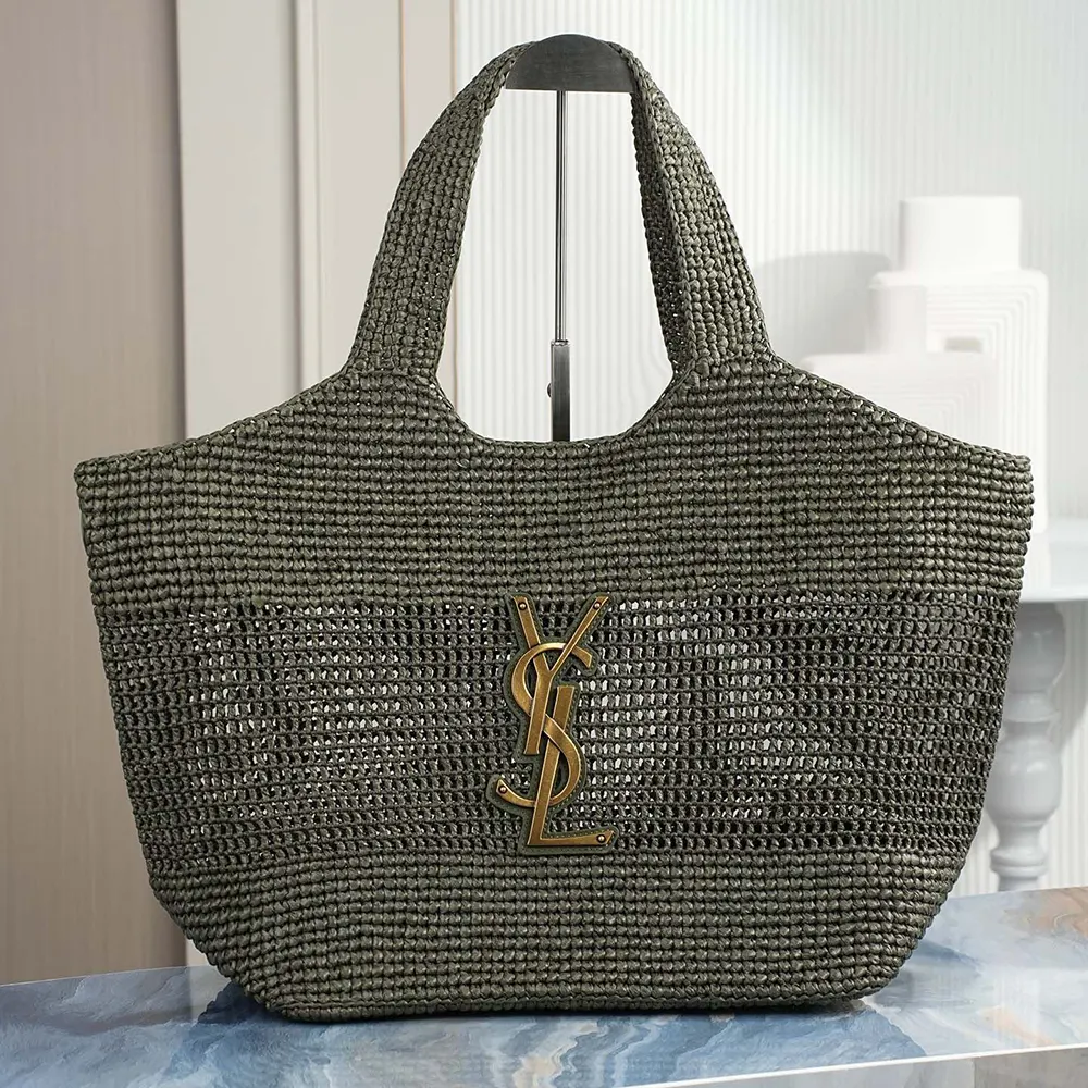 Close-up of gold YSL logo and raffia texture on Saint Laurent YSL Women Icare bag