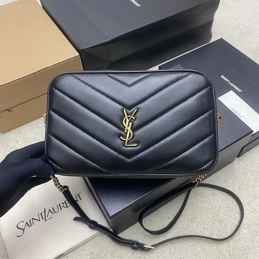 Close-up on gold YSL logo hardware on Saint Laurent YSL Women Loulou Camera Bag