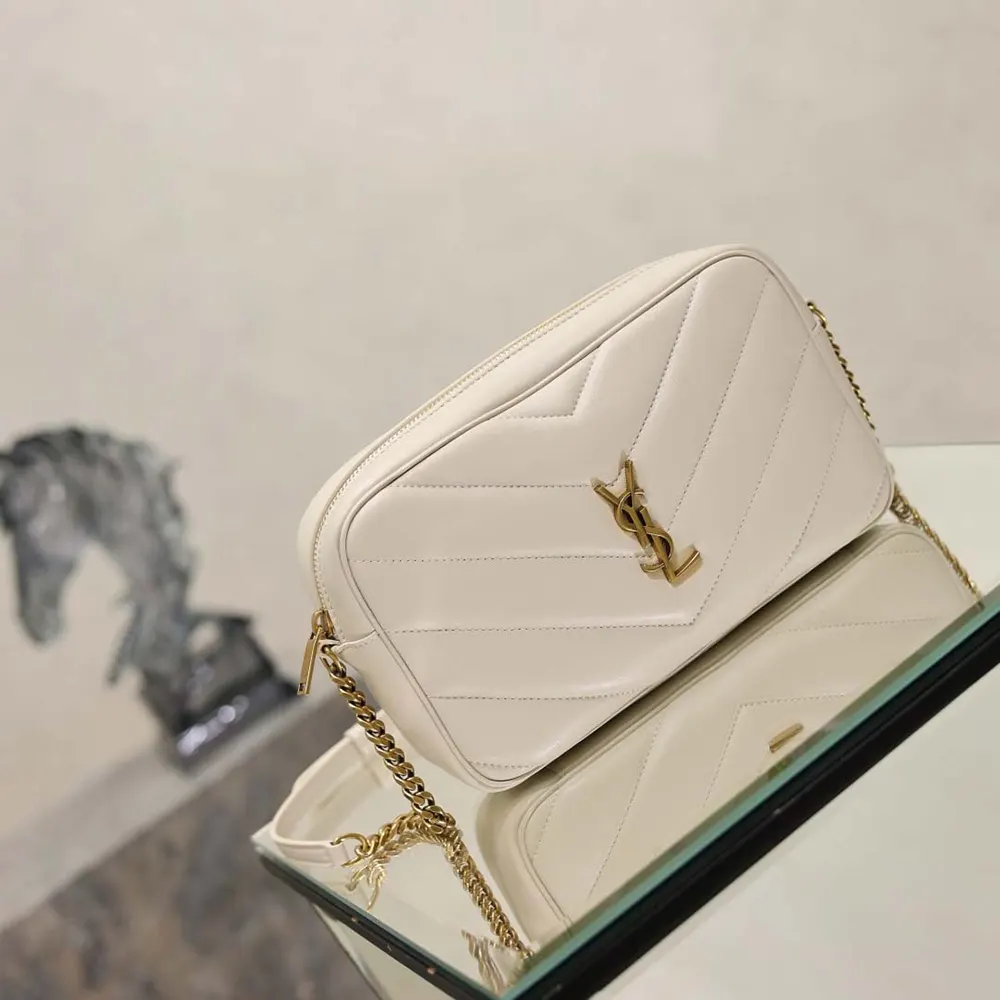 Side angle showing structured silhouette and adjustable strap of Saint Laurent Loulou bag