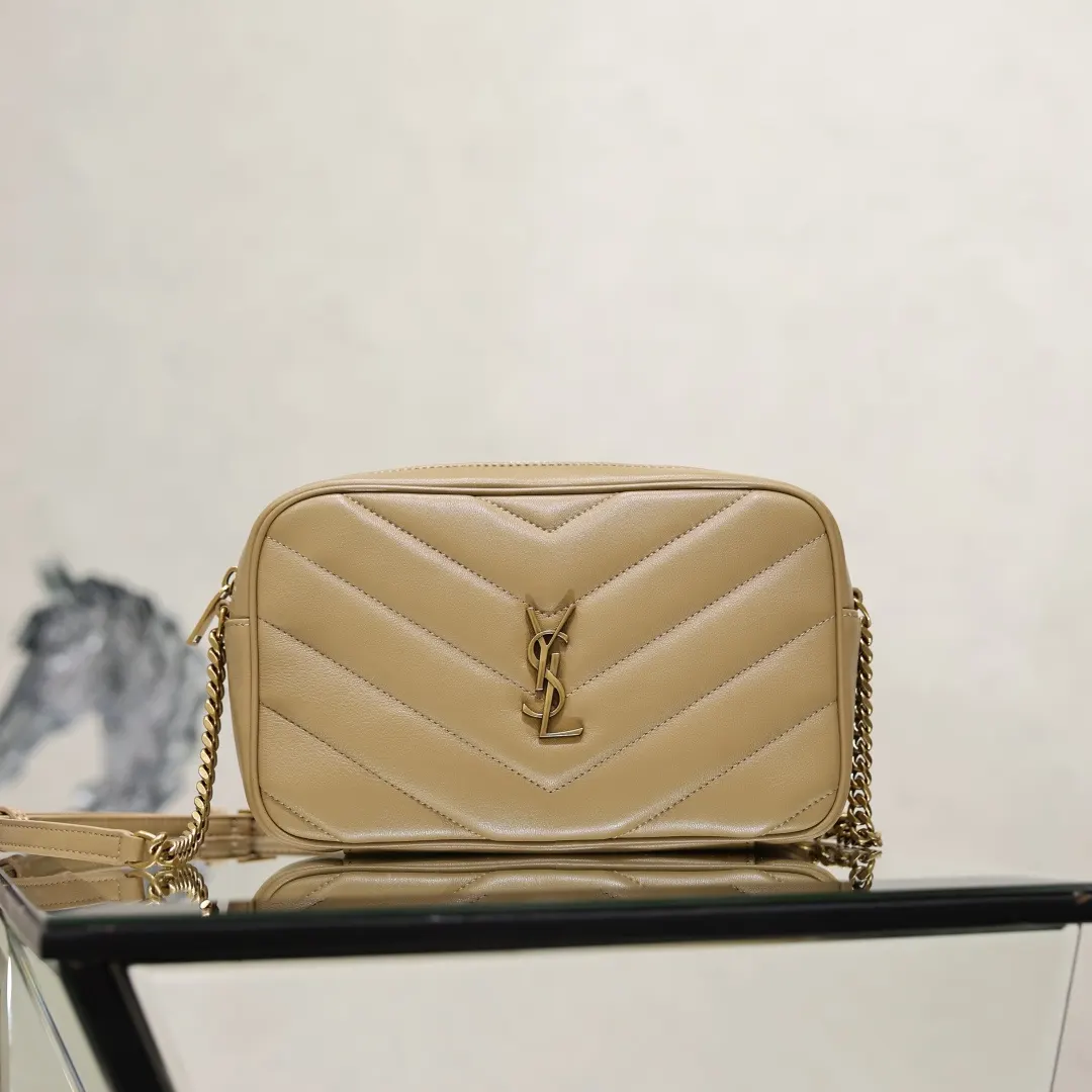 Close-up of quilted lambskin texture and YSL gold hardware detail