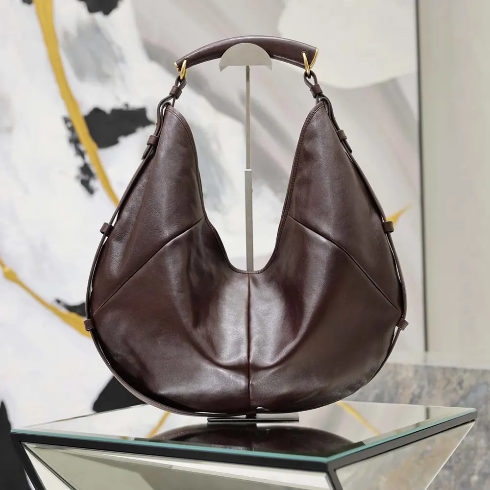 Close-up of burgundy pony hair texture on YSL Women Mombasa handbag