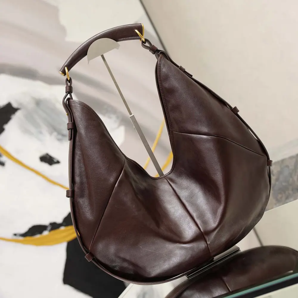 Gold YSL logo hardware detail on Mombasa Large pony hair leather bag