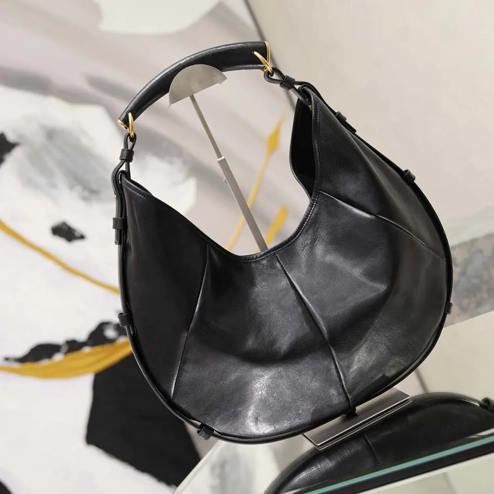 Side profile showing slim silhouette of Saint Laurent YSL Women Mombasa Medium