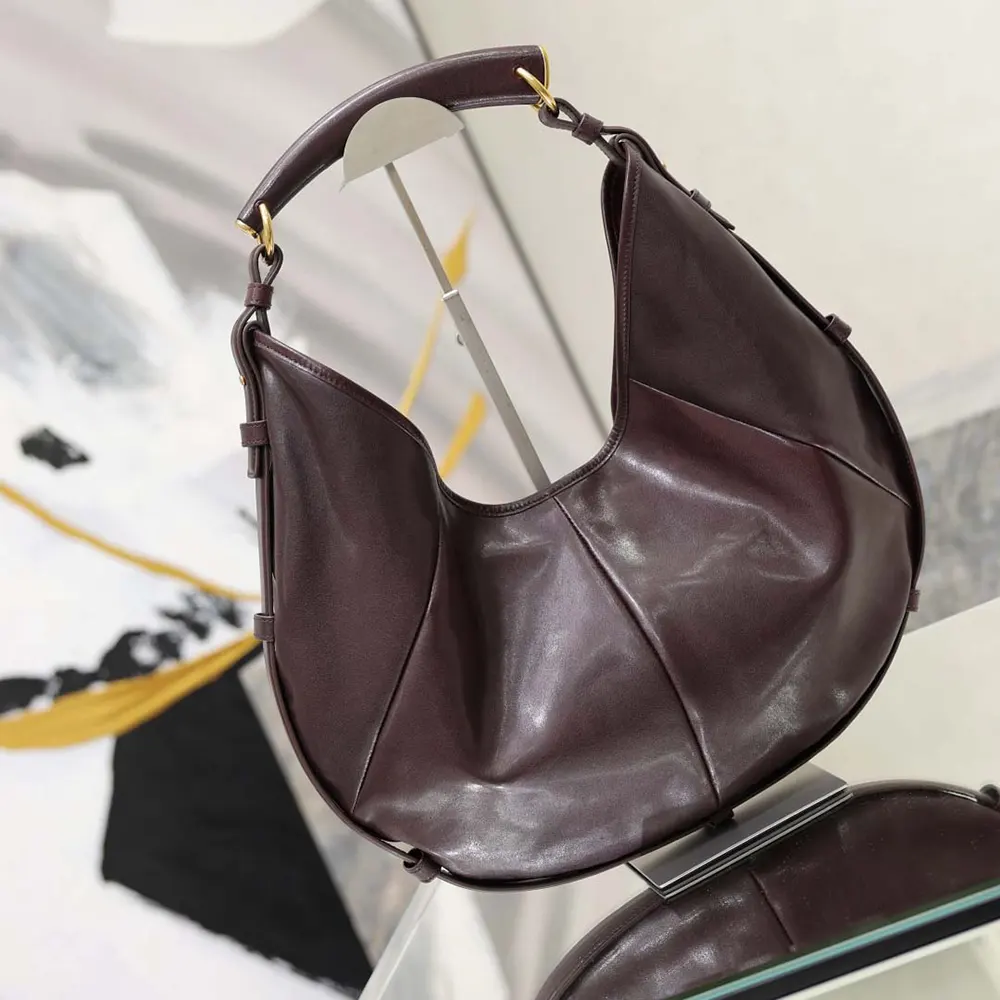 Side angle showing magnetic closure on Saint Laurent YSL Women Mombasa bag