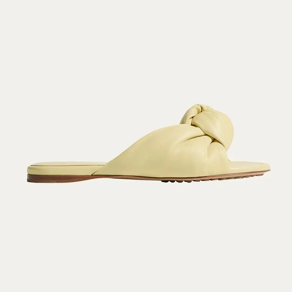 Side angle of Bottega Veneta Women Lagoon Nappa Leather Knotted Flat Slide Sandals Yellow