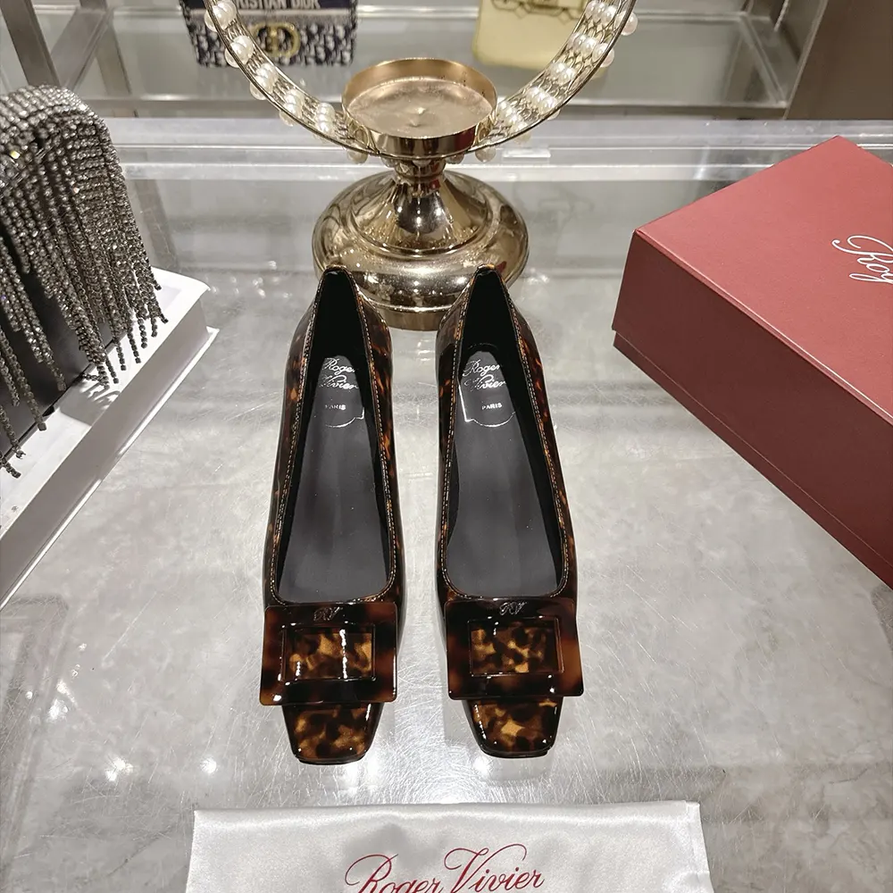 Close-up of silver buckle on Roger Vivier Women Belle Vivier Pumps