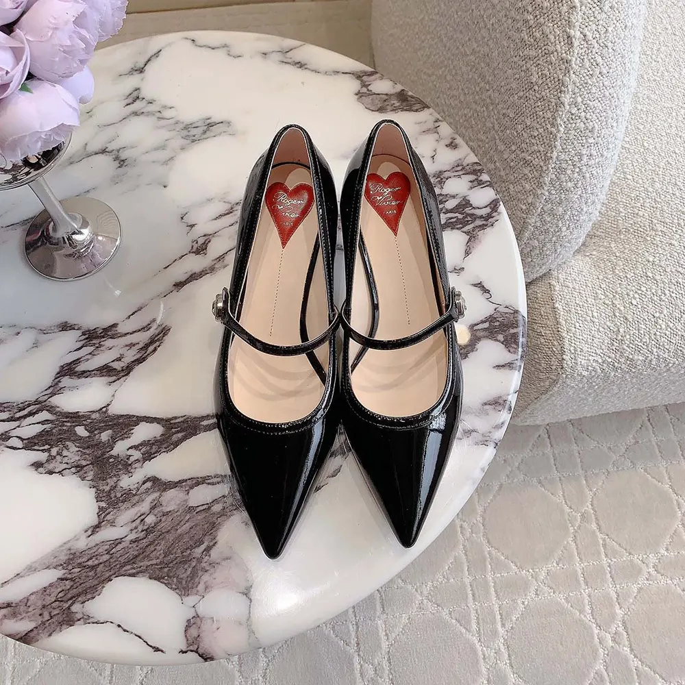 Top view showcasing patent leather strap and sleek silhouette of Roger Vivier mules