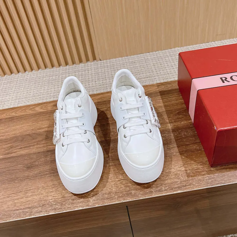 Close-up of signature metal buckle on Roger Vivier Viv Skate Sneakers
