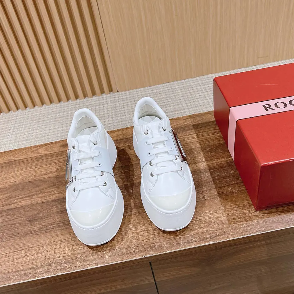 Top angle showing laces and silhouette of Roger Vivier white sneakers