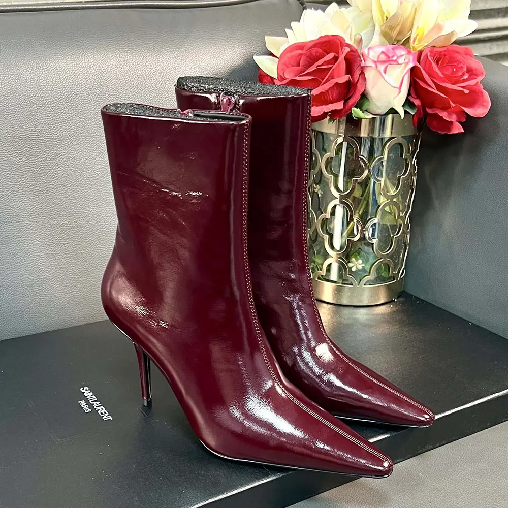 Close-up of YSL logo hardware on Saint Laurent YSL Ashley Booties