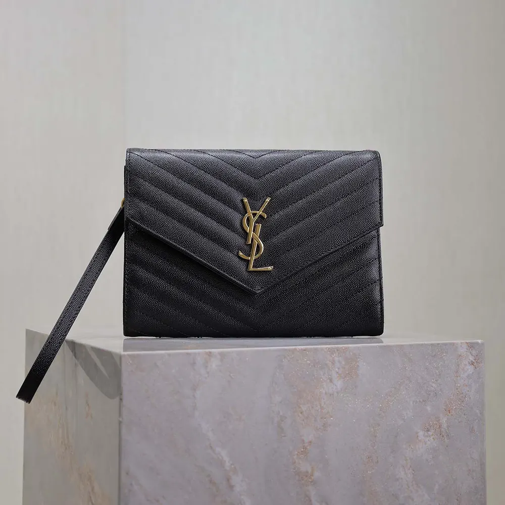 Close-up of gold YSL logo hardware on Cassandre Matelassé Flap Pouch