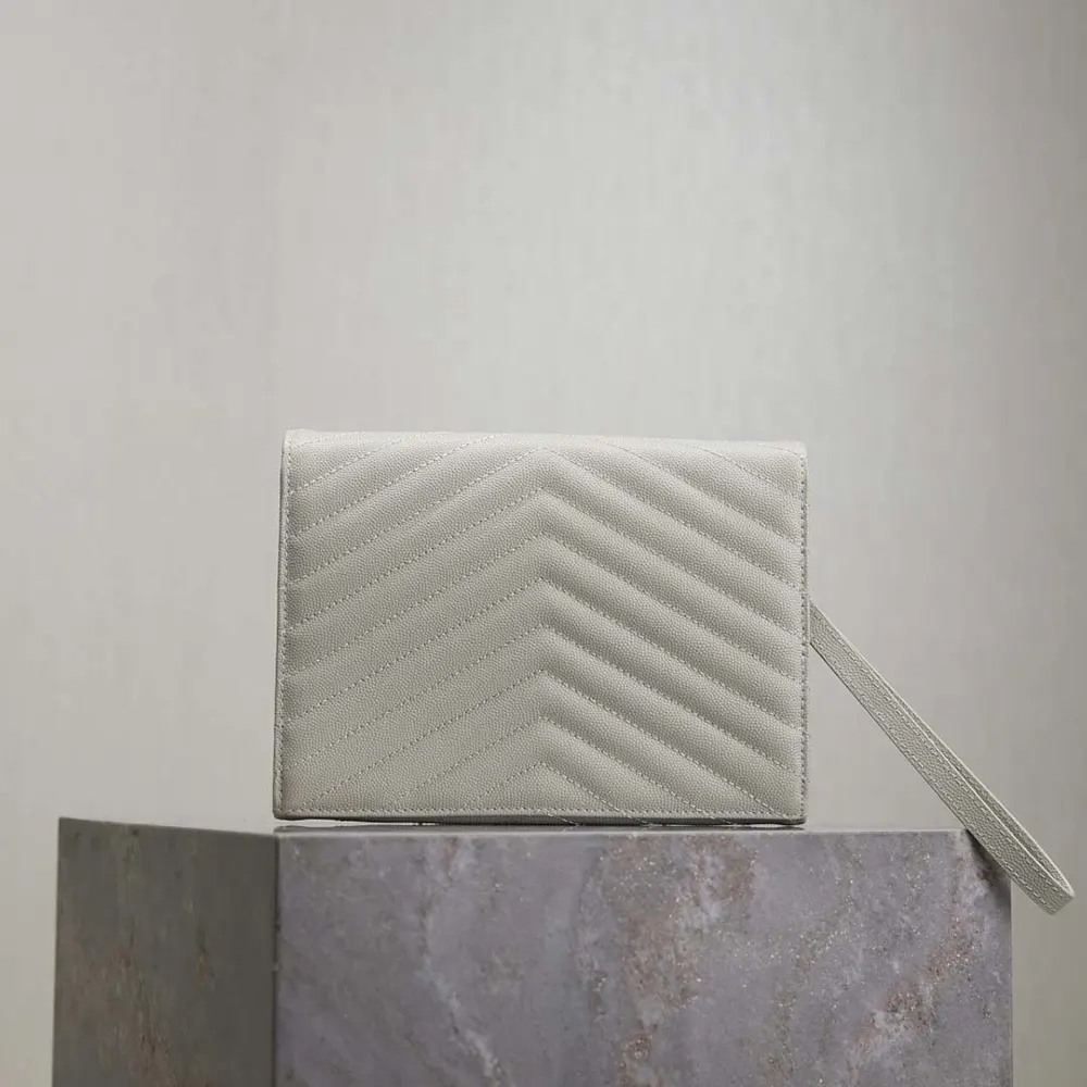 Side angle showing texture and stitching on Saint Laurent YSL white pouch