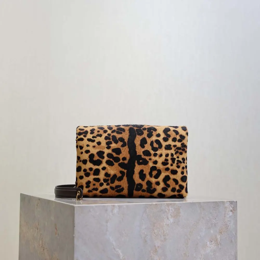 Side view of Saint Laurent YSL Cassandre pouch showing chain strap detail