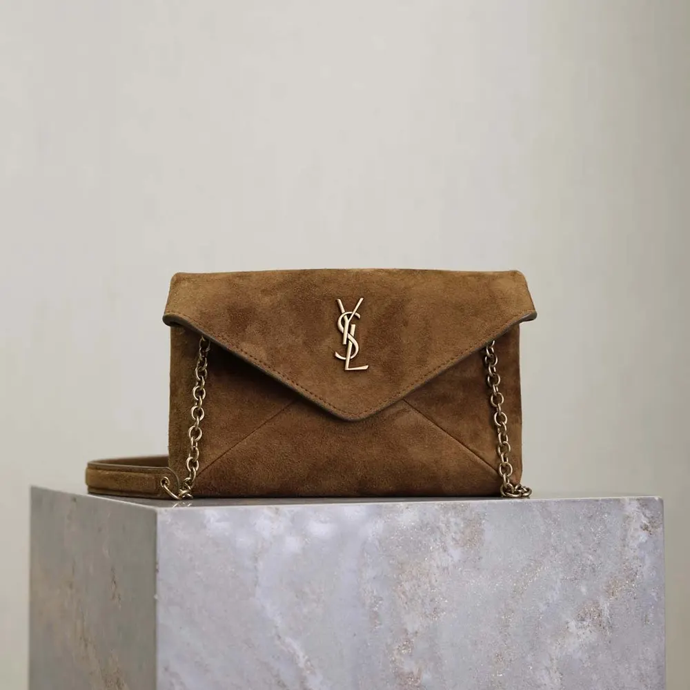 Close-up of gold-tone YSL chain closure on Saint Laurent Suede Chain Pouch