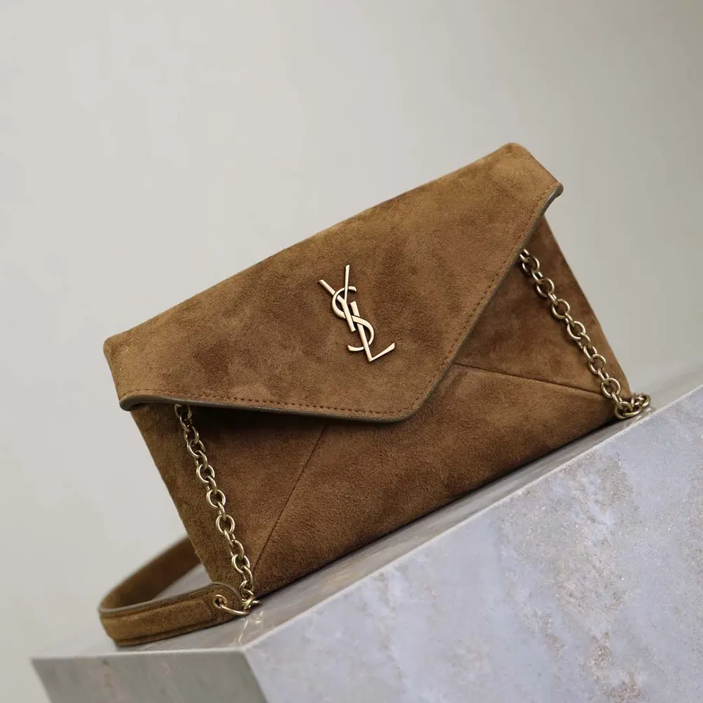 Side profile showing compact silhouette of Saint Laurent YSL Suede Small Chain Pouch