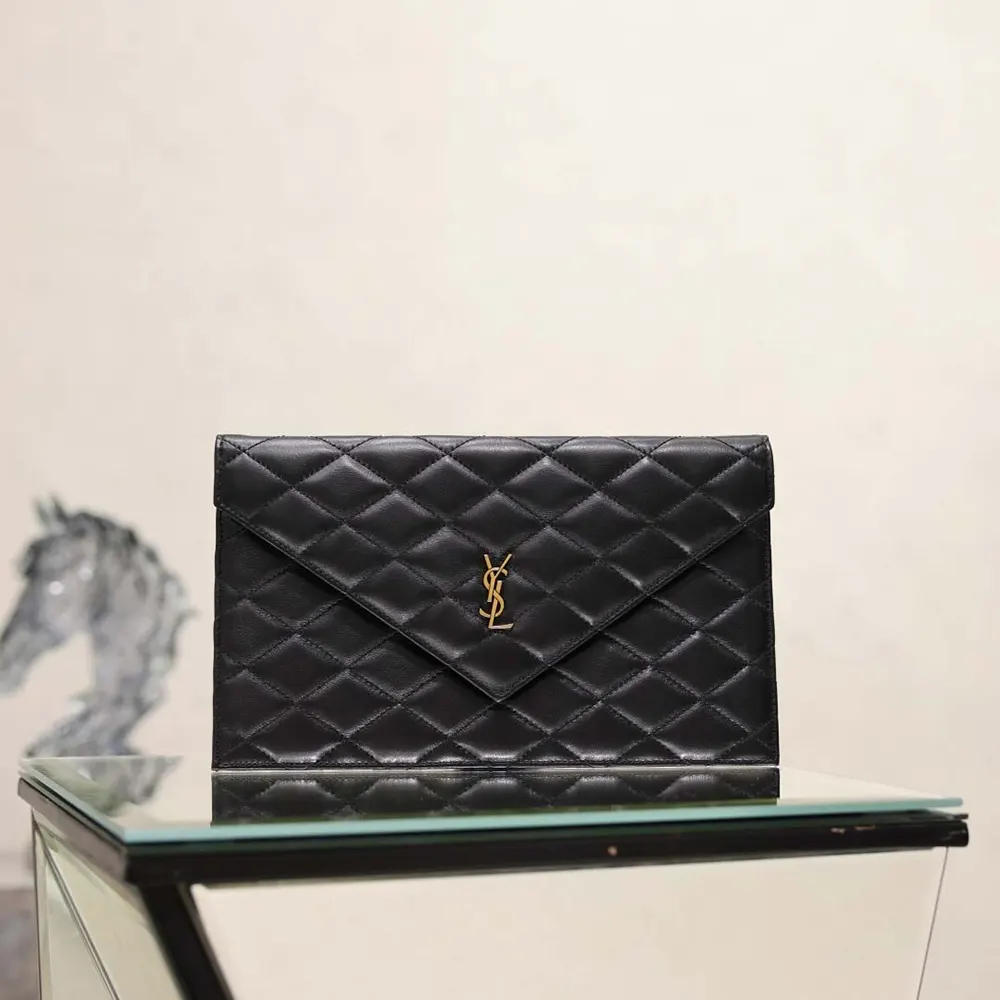 Close-up of gold-tone YSL logo on black lambskin Paris Pouch