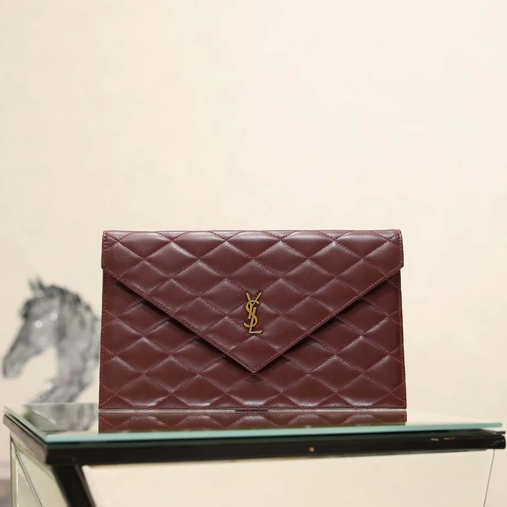 Side angle of Saint Laurent YSL Women Paris Pouch highlighting lambskin texture and silhouette